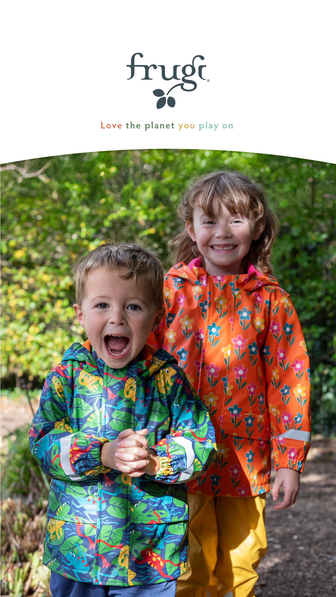 Three children sitting on a stairs wearing bright organic cotton clothing